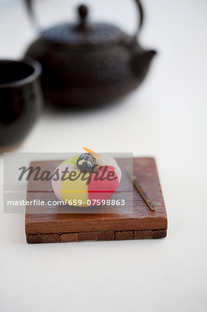 Wagashi camellia with a pot of tea (Japan)