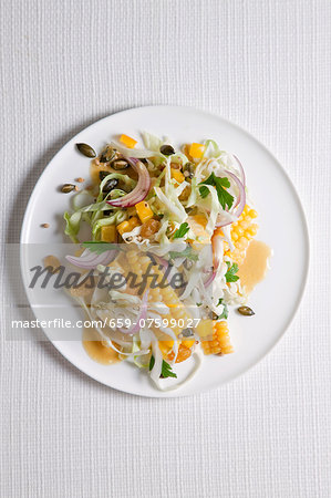 Cabbage and sweetcorn salad with raisins and pumpkin seeds