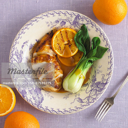 Chicken breast with orange sauce and pak choi