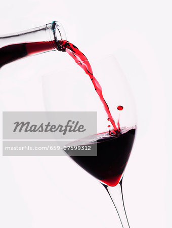 Red wine being poured into a glass Red wine being poured into a glass
