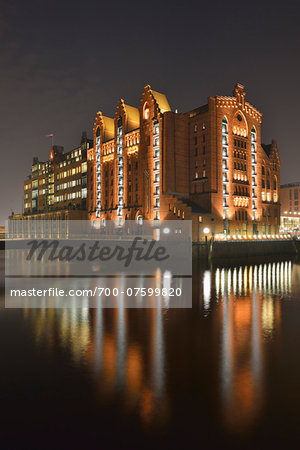 View of Internationales Maritimes Museum at night, Speicherstadt with River Elbe, Hamburg, Germany
