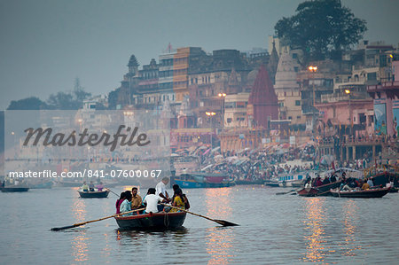 Traditional scenes of tourists on on River Ganges at Varanasi, Benares, Northern India