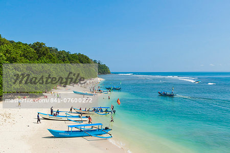 Outrigger boats on beautiful white sand beach in the national park on the south coast at Pangandaran, West Java, Java, Indonesia, Southeast Asia, Asia