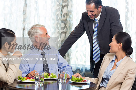 Business colleagues having meal