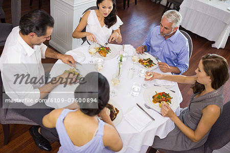 Business colleagues dining at table in restaurant