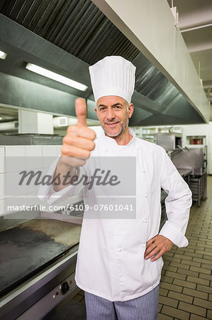 Happy chef looking at the camera giving thumbs up