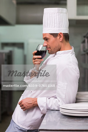 Chef relaxing with glass of red wine after work