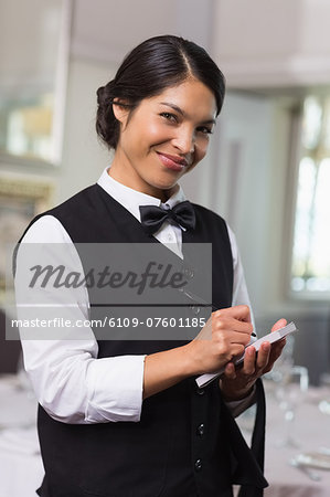 Pretty waitress taking an order