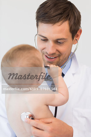 Pediatrician checking baby boy