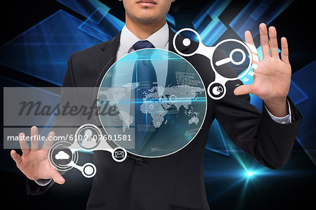 Businessman touching earth interface with graphics
