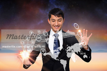 Smiling businessman touching earth interface