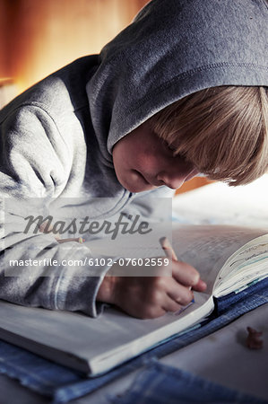 A boy with his homework