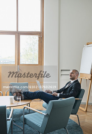 Businessman working on laptop, Stockholm, Sweden