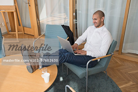 Businessman working on laptop, Stockholm, Sweden