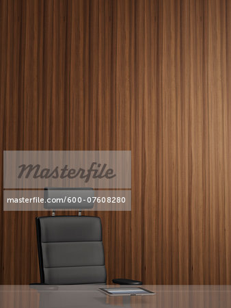 Illustration of office arm chair in front of wooden wall, tablet computer on glass table, studio shot Illustration of office arm chair in front of wooden wall, tablet computer on glass table, studio shot