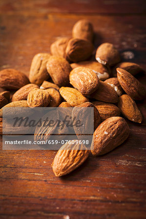 Almonds on a wooden surface