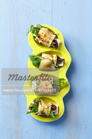 Barbecued rolls of courgette stuffed with feta, sundried tomatoes and rocket Barbecued rolls of courgette stuffed with feta, sundried tomatoes and rocket