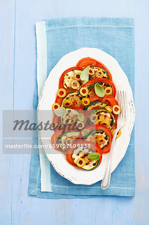 Tomato salad with olives and grilled courgette