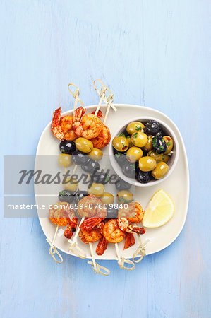 Prawn and olive skewers and marinated olives