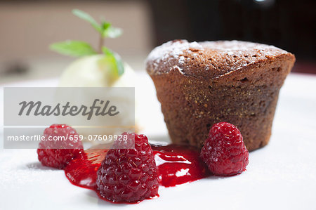 Choco muffin with raspberry and vanilla ice cream