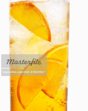 A glass of Aperol with orange slices (close-up) A glass of Aperol with orange slices (close-up)