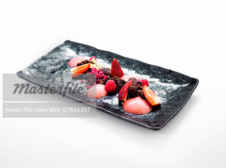 Chocolate desert with fresh berries and strawberry ice cream