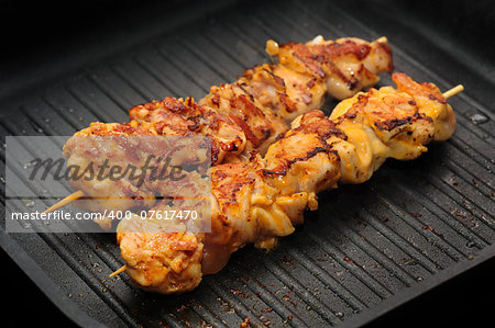 preparation of chicken shish kebab on skewers