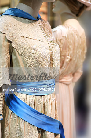 Pair female mannequins with vintage beige dresses