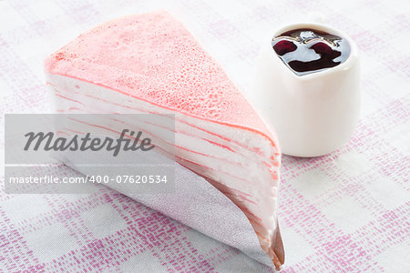 Delicious dessert crepe cake and blueberry sauce, stock photo