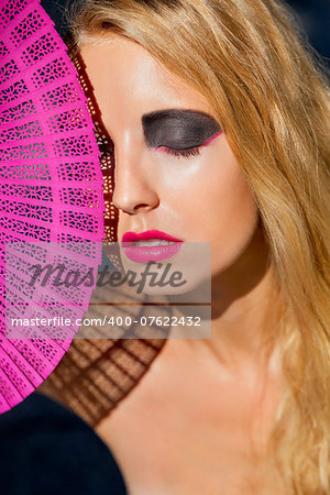 young beautiful woman with smokey eyes and pink lips portrait makeup