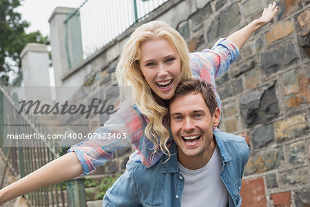 Hip young couple having fun on a sunny day in the city