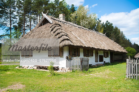 Old rural house with thatched roof near Bialystok, Poland