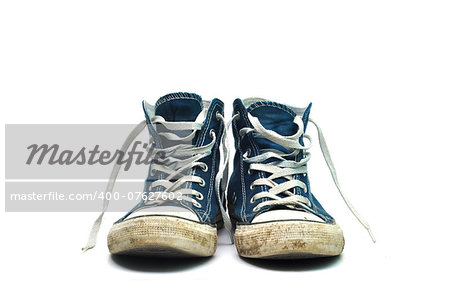 old sneakers dirty sport shoes over white background