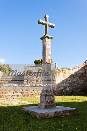 Stone cross in a column in Castro Park in Vigo, Pontevedra, Galicia, Spain.