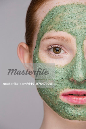Cropped image of young woman wearing face mask