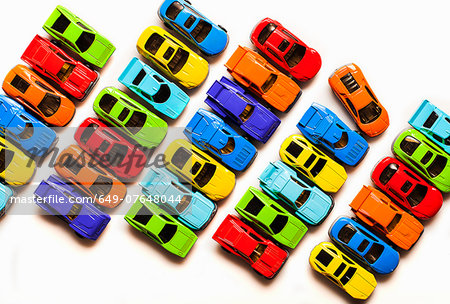 Still life with rows of colorful toy cars