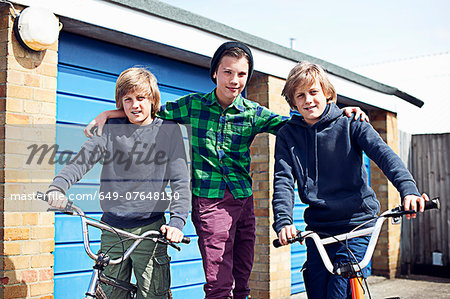 Portrait of three boys with bikes