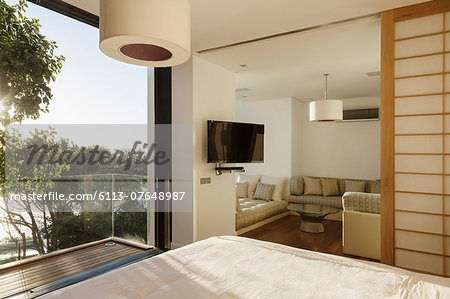 Sunny bedroom with balcony