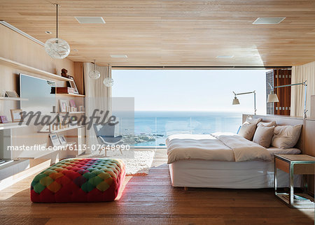 Sunny bedroom with ocean view