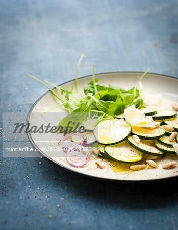 Raw zucchini,parmesan and pinenut salad