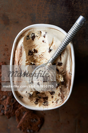 Overhead View of Ice Cream with Ice Cream Scoop on Metal Background, Studio Shot Overhead View of Ice Cream with Ice Cream Scoop on Metal Background, Studio Shot