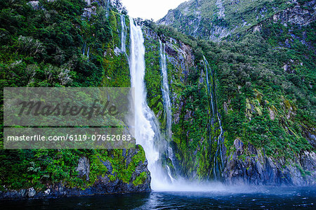 Huge waterfall in the Milford Sound, Fiordland National Park, UNESCO World Heritage Site, South Island, New Zealand, Pacific