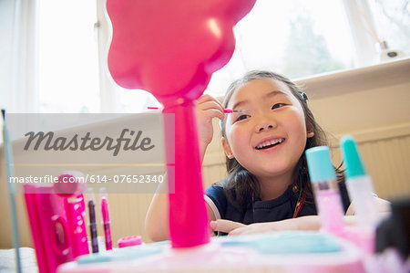 Girl putting make up on