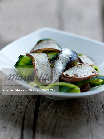 Thin strips of zucchini with anchovies and sauteed turnips