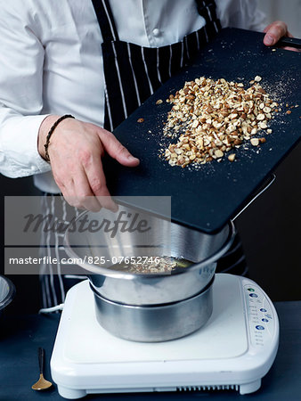 Adding the crushed hazelnuts Adding the crushed hazelnuts