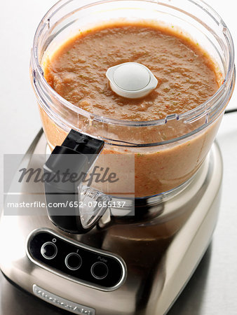 Mixing the vegetables for gaspacho in a blender