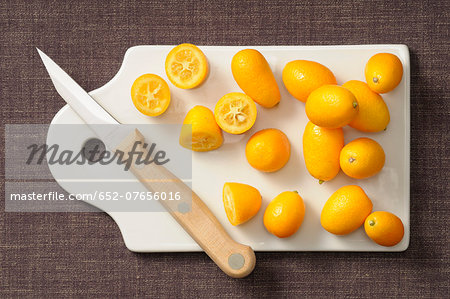 Kumquats on a chopping board