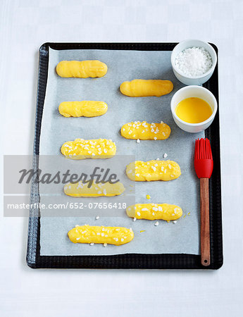 Coating the Eclairs with egg yolk before cooking