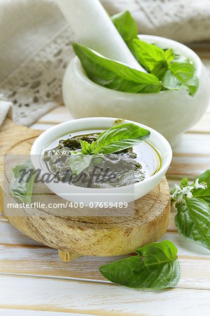 pesto sauce of fresh green basil leaves with olive oil