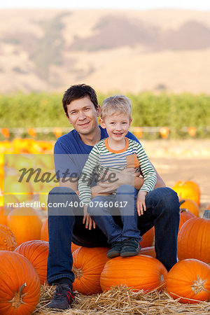 family of two at pumpkin patch